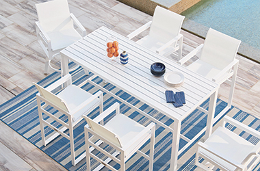 outdoor sling chairs and white dining table