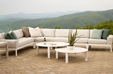  patio with modular sectional around a table in the center