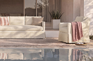 two chairs and woven tables in an outdoor setting