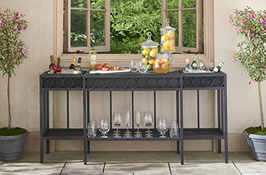 multi-purpose console table with drinks, fruit and glasses