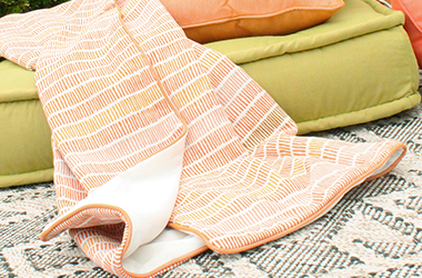 orange patterned throw blanket